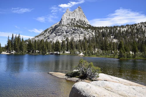 Free Upper Cathedral Lake and Cathedral Peak at Yosemite National Park, California.  Stock Photo