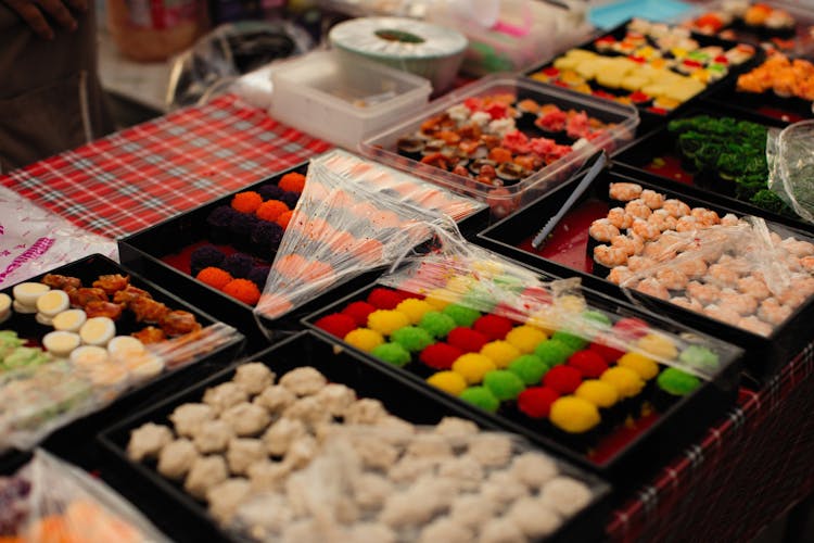 Sushi Sets In Boxes On Table