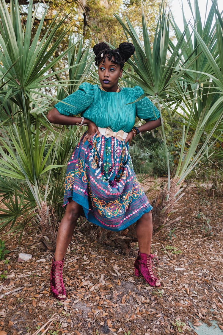 Woman In Colorful Dress Standing With Hands On Hips