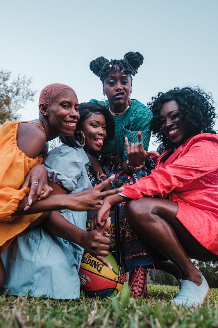 Group of Smiling Women Posing For Picture