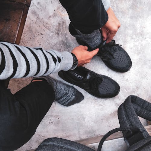Free Person Wear Black Adidas Shoes Stock Photo