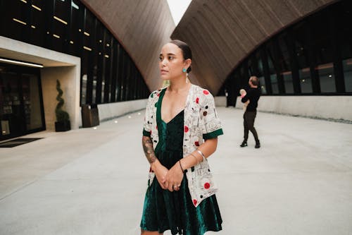 Woman in Green Dress Standing in a Yard of Winter Park Events Center, Florida, USA