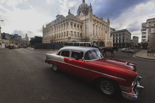 Retro Car Driving on City Street