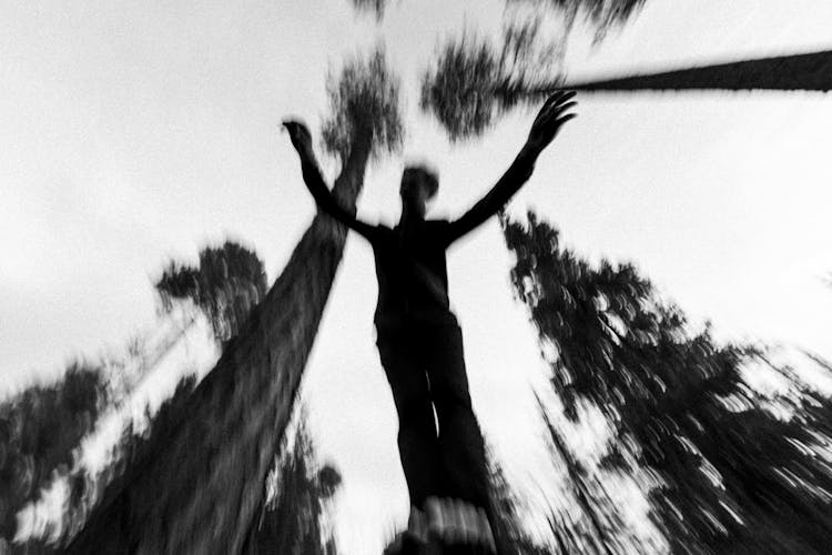 Person Jumping In Forest