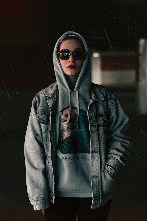 Woman Standing Wearing Sunglasses and Hoodie Jacket