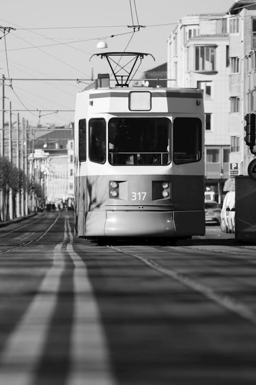 Grayscale Photo of Tram in the City