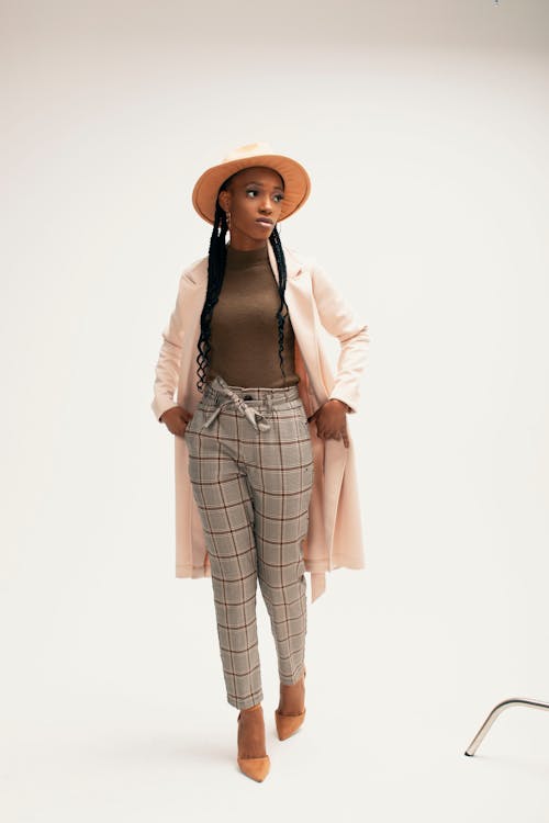 Woman in Hat Posing in Studio