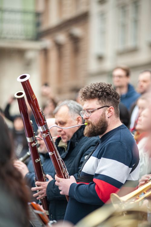Free Musicians play bassoons in a street orchestra in Lviv, Ukraine, capturing the vibrant city atmosphere. Stock Photo