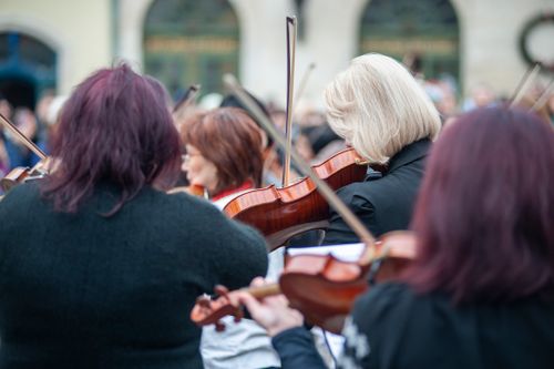 Free Musicians playing violins during an outdoor concert in Lviv, Ukraine. Stock Photo