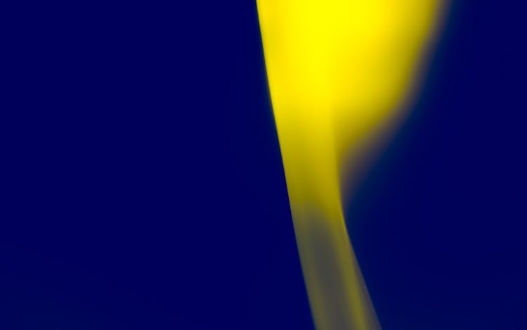 Yellow Flame Against Blue Background