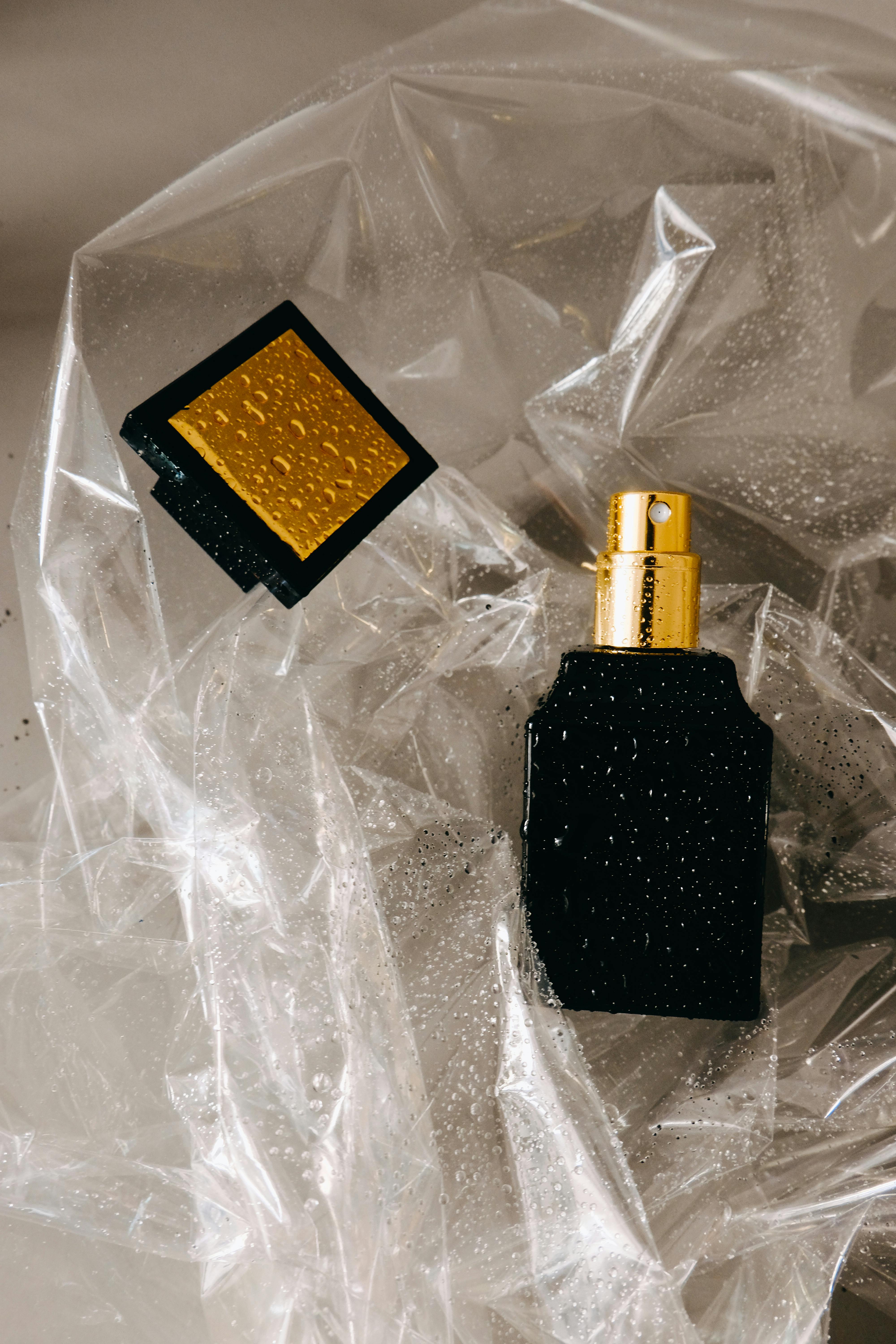 a black and gold perfume bottle