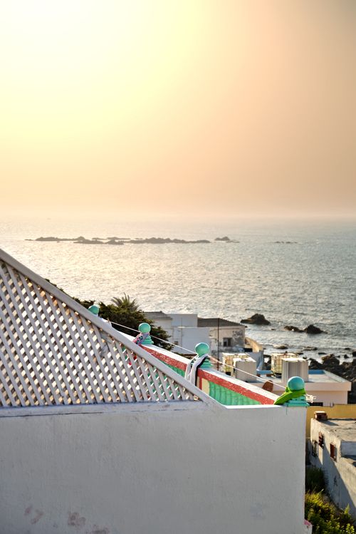 Free A tranquil sunset view from a rooftop overlooking the sea in Tanger, Morocco. Stock Photo