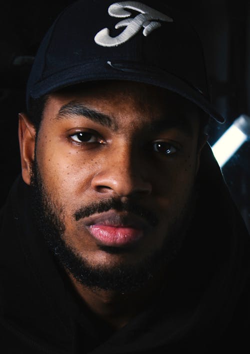 Close-Up Shot of a Man Wearing a Cap