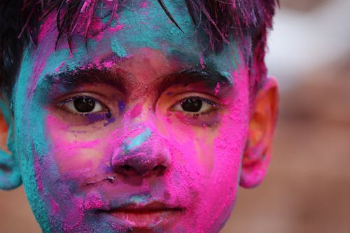 Young Man With Colorful Paint on Face