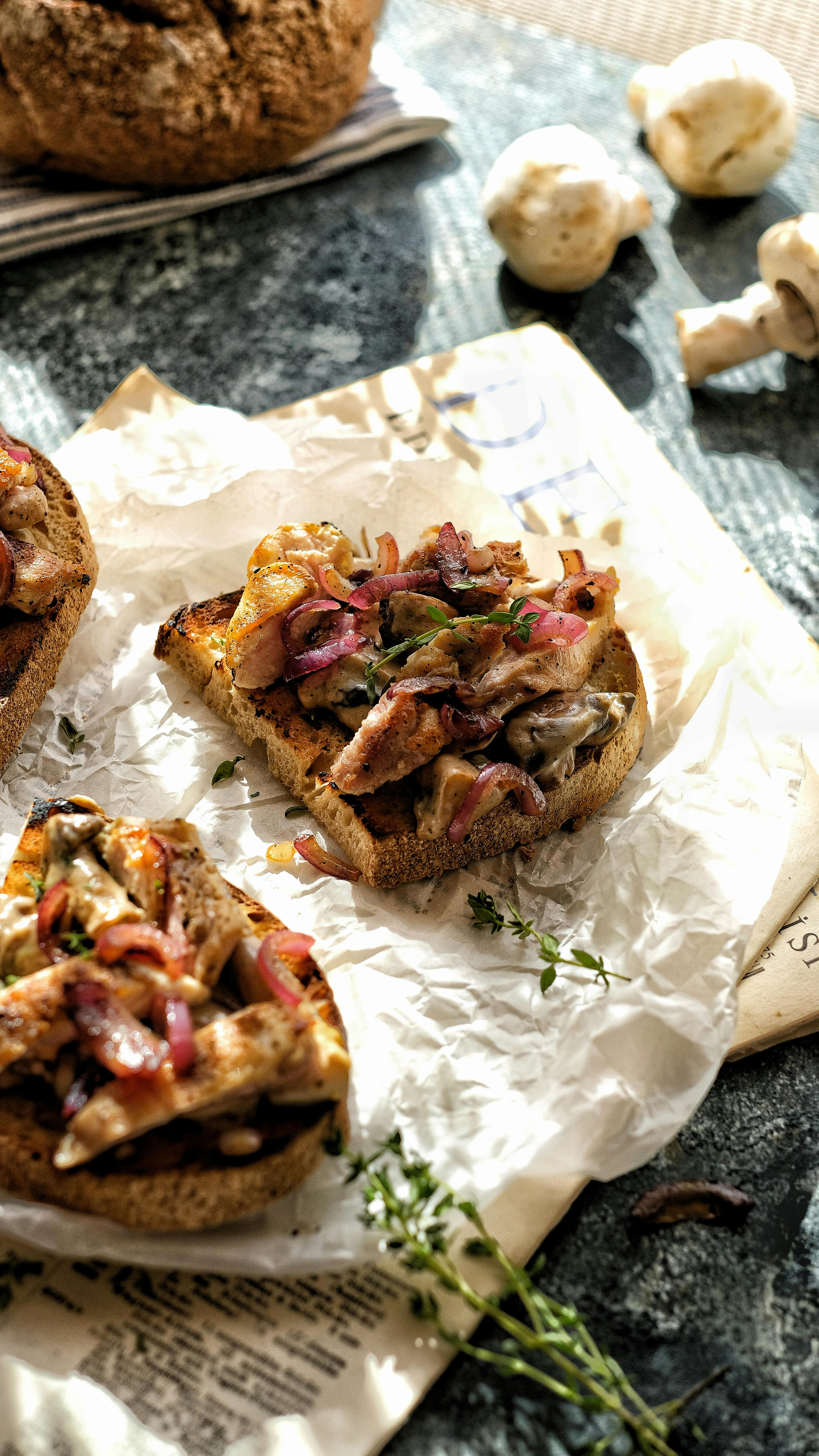 Savor this delicious mushroom bruschetta topped with herbs, perfect for a rustic meal setting.