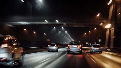 Free Blurred motion view of cars driving fast on a highway at night in Riga, Latvia. Stock Photo
