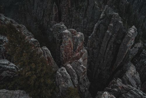 Free Aerial view of rugged rocky cliffs in Colorado, USA, showcasing unique geological formations. Stock Photo