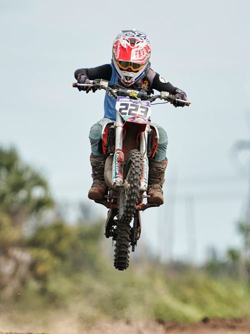 Free Motorcyclist Jumping during Motocross Race Stock Photo