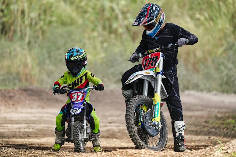 A Father And Son Riding Motocross 