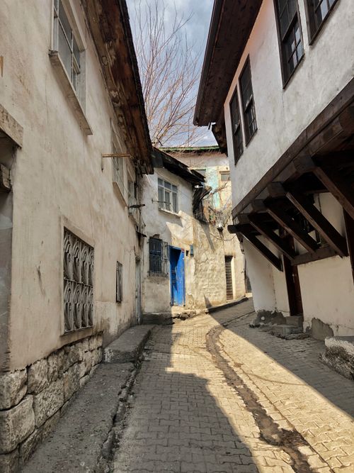 Free Explore the charm of a historic and narrow alleyway in Çankırı, Türkiye, with sunlight cascading on the traditional architecture. Stock Photo