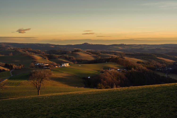 Peaceful Landscape Of Hills And Countryside Houses