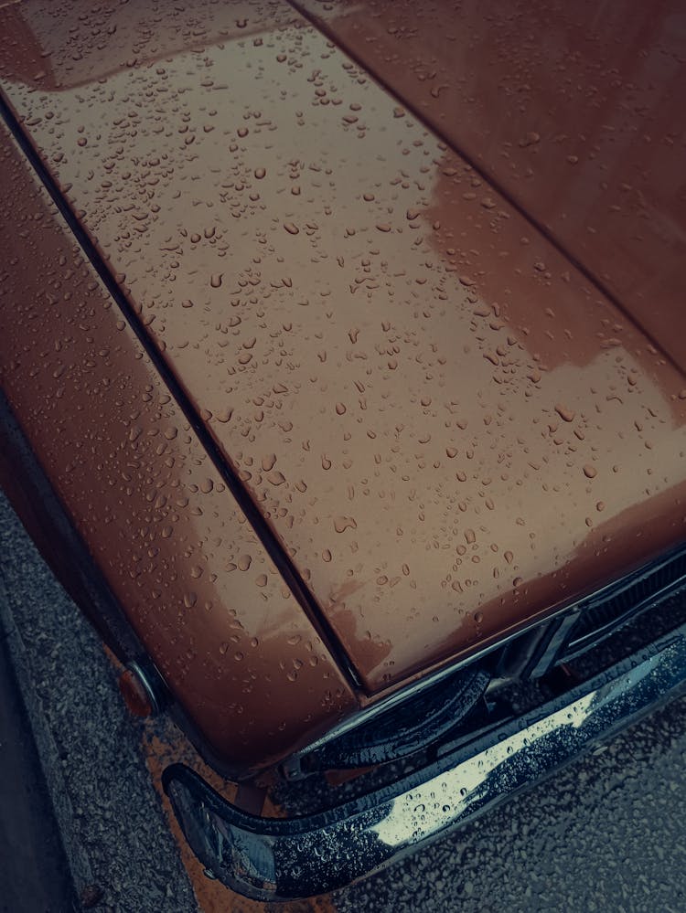 Classic Brown Car With Water Droplets On Hood