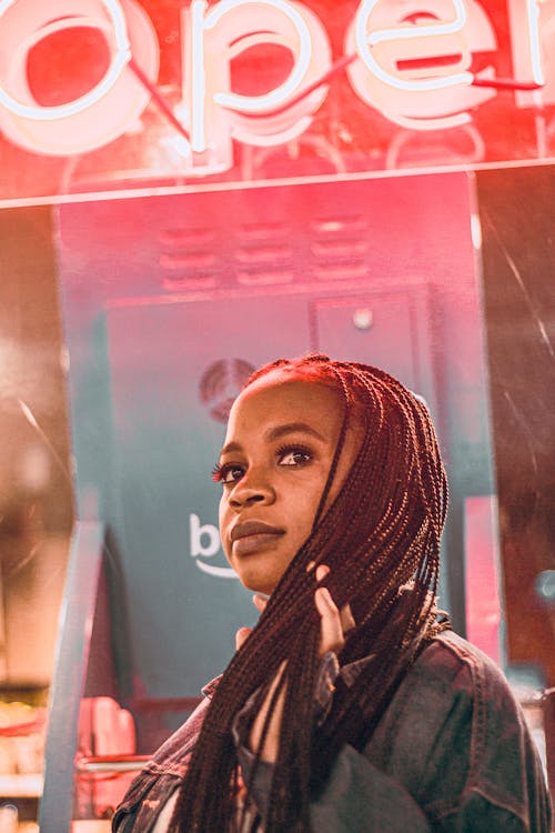 Close-Up Shot of a Woman with Braided Hairstyle