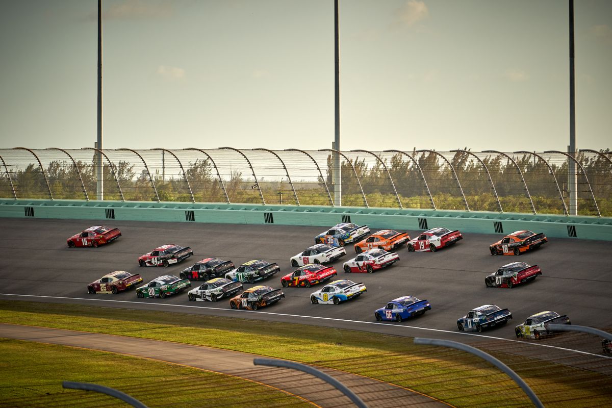 Performance car taking a high-speed corner on track