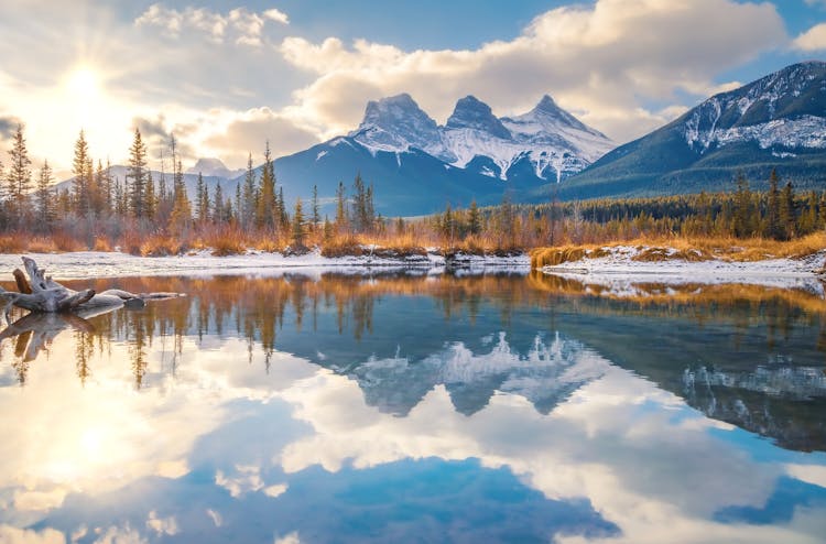 Three Sisters Mountain With Reflections On River