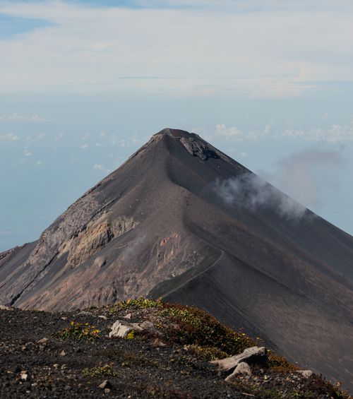 Free A stunning view of an active volcano in Sacatepéquez, Guatemala, showcasing its rugged peak. Stock Photo