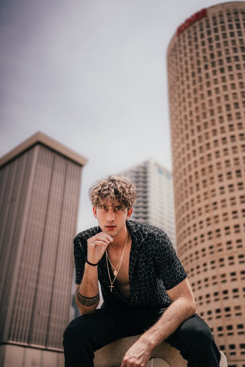 Photo of a Man Posing with His Hand on His Chin