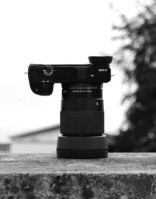 A Black Camera on a Concrete Surface