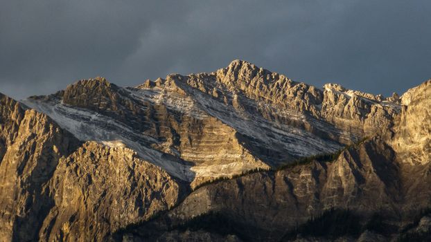Majestic mountain landscape in Canmore, Alberta with dramatic sky.