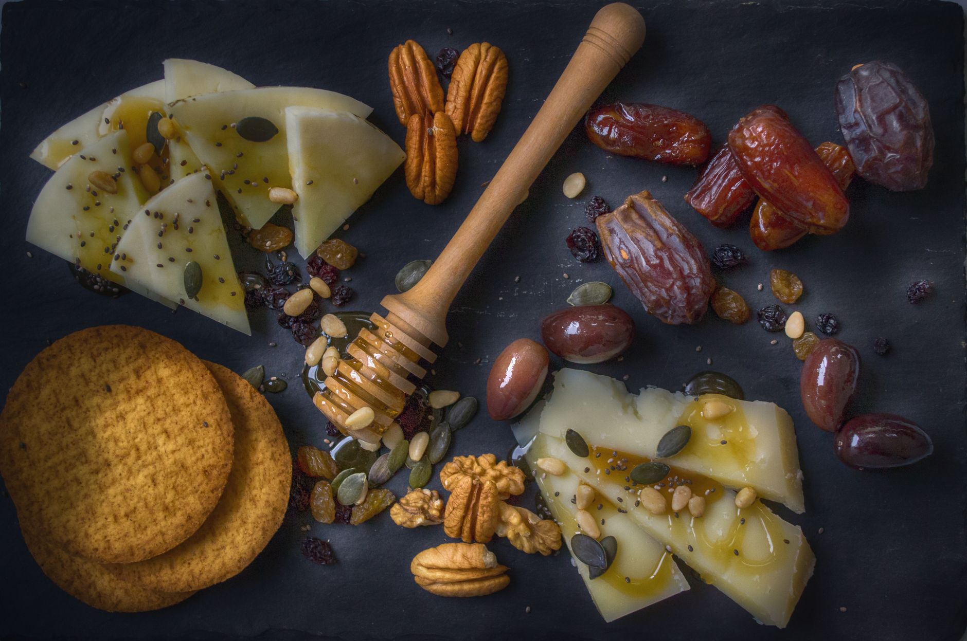 Glass jar of honey walnut cream cheese with wooden spoon