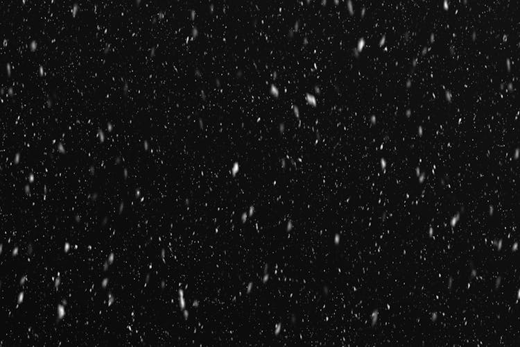 Photograph Of Snow With A Black Background