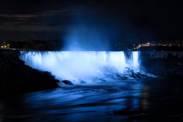 Illuminated Waterfall At Night