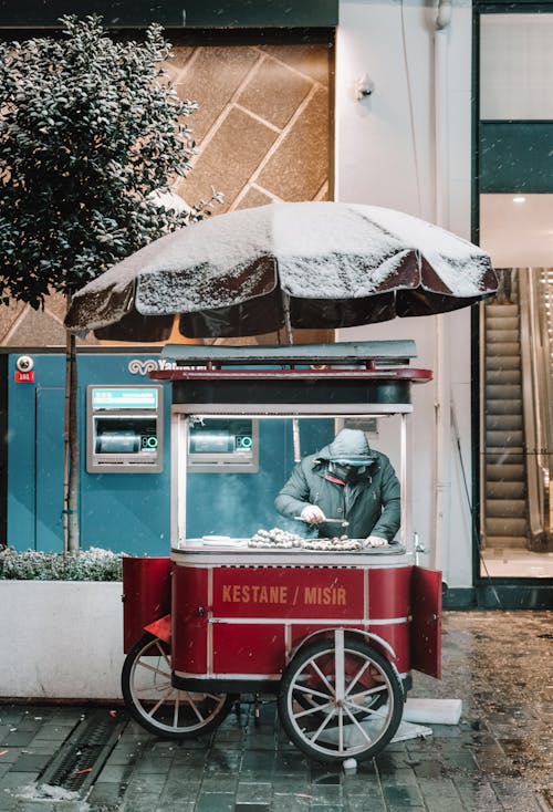 A Food Vendor with a Three Wheeler Stall