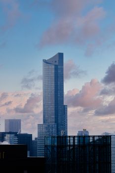 Tall skyscraper under a vibrant sky in Toronto, highlighting modern architecture.