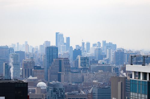 Free Stunning aerial view of Toronto's skyline with skyscrapers on a foggy winter day. Stock Photo