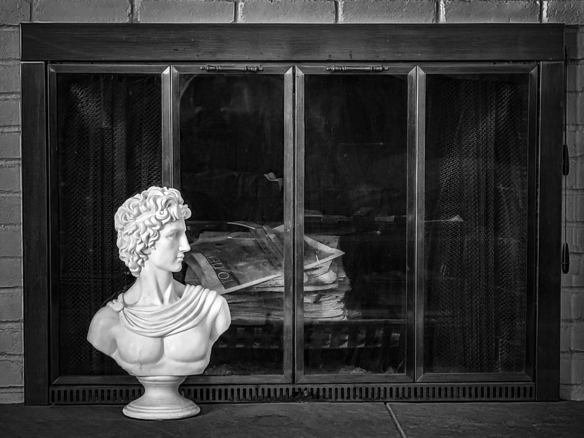 Apollo Statue Beside a Fireplace