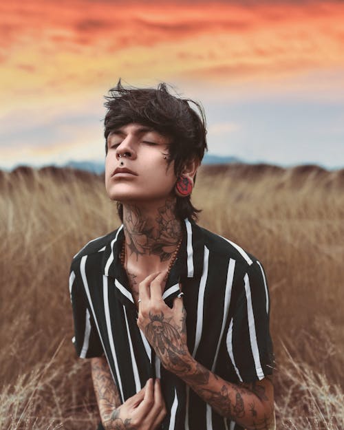 Free Portrait of a Man with Tattoo during Sunset Stock Photo