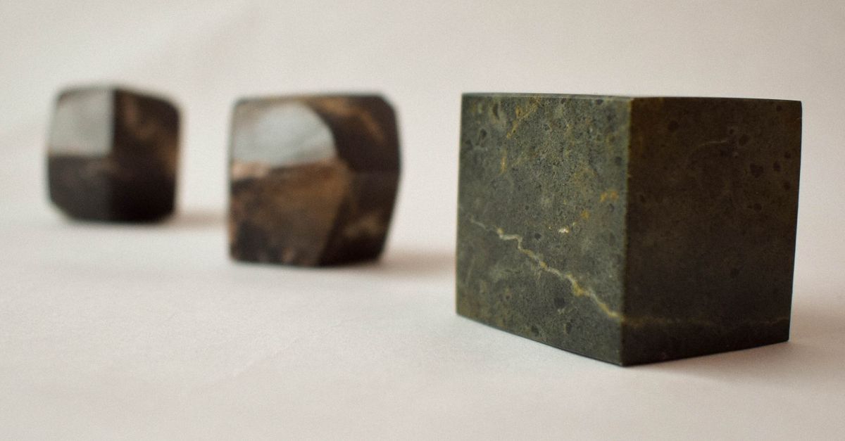 Normal Cube Rocks A Cube and Rocks on a White Background · Free Stock Photo