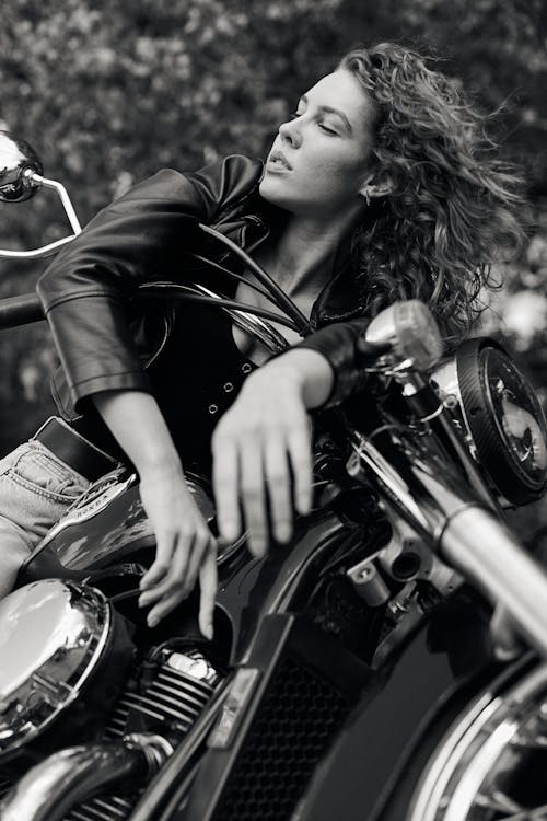 Monochrome Photo of Woman on a Motorcycle