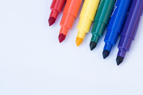 Free Used Pens on White Surface Stock Photo