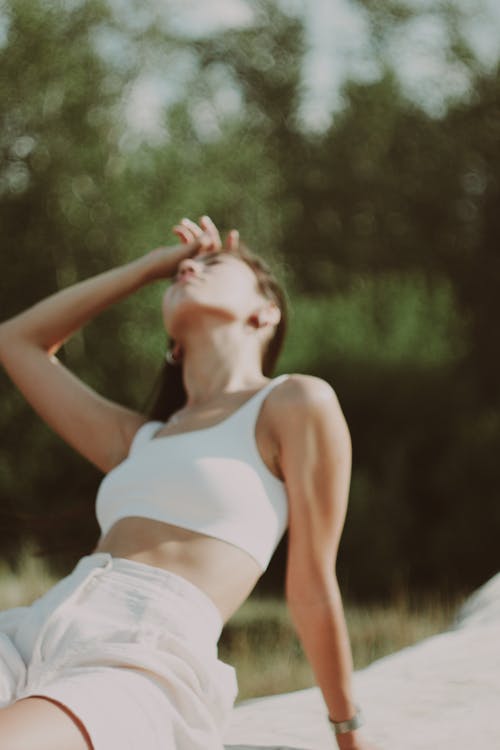Free Close-Up Shot of a Woman in White Crop Top  Stock Photo