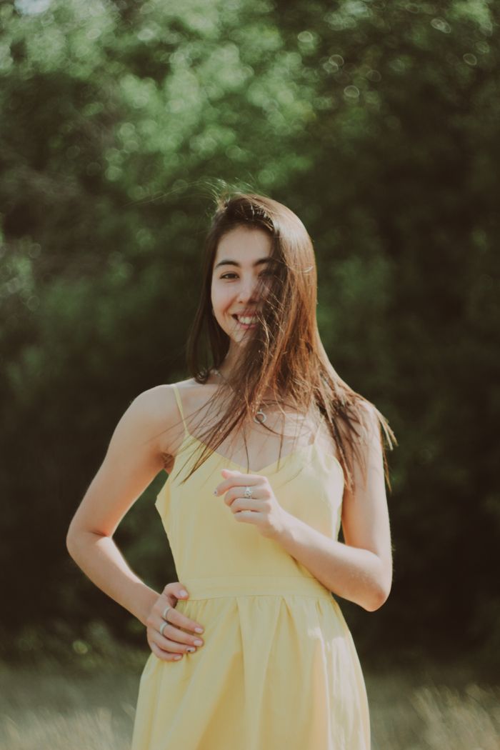 Woman in a pale yellow slip dress outdoors, photo by Fayzel Camila on Pexels