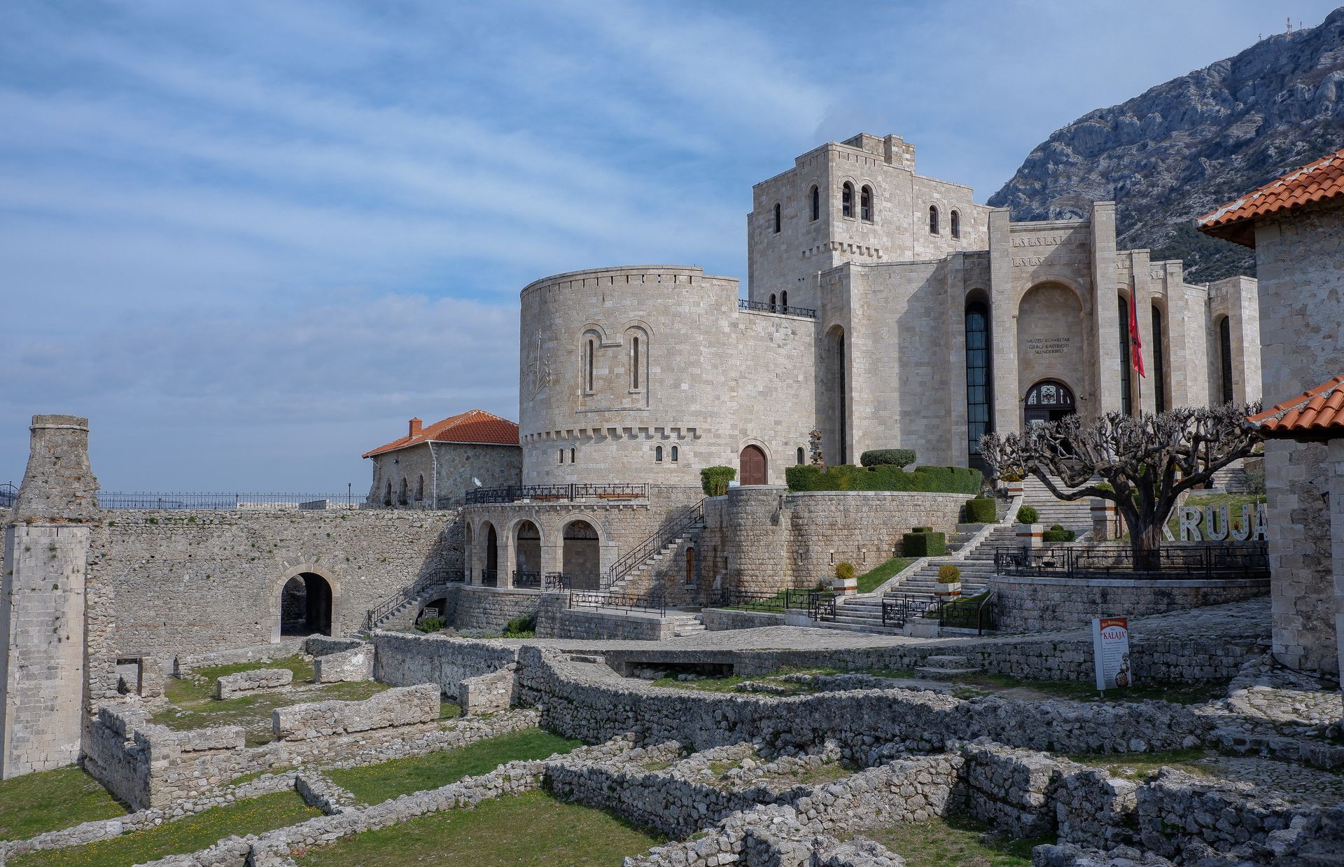 Explore the historic Krujë Castle in Albania with stunning architecture and scenic mountain views.