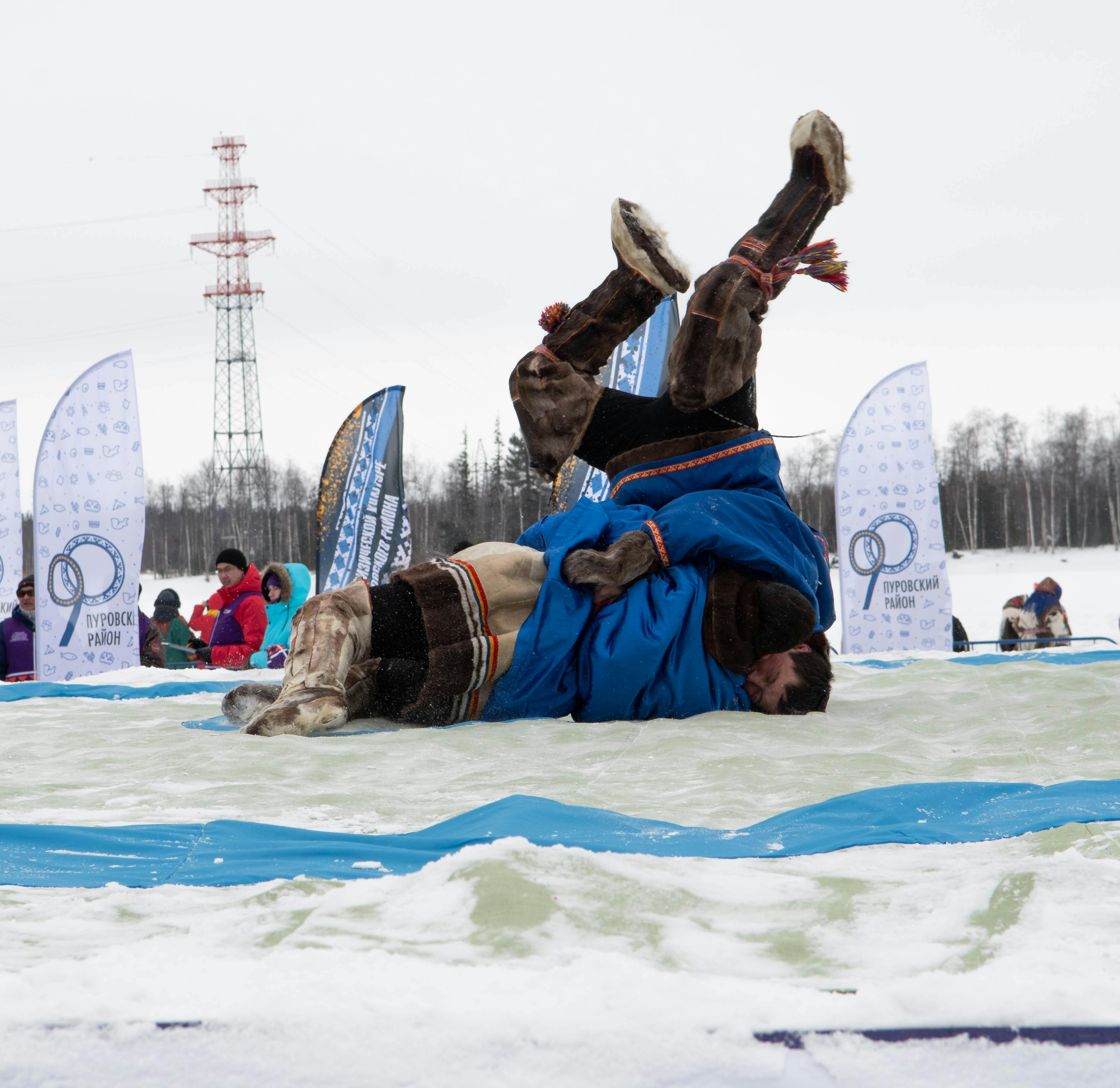 Men Wrestling in a Sporting Competition