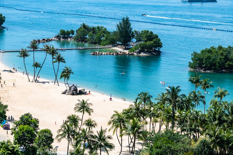 People Enjoying The White Sand Beach