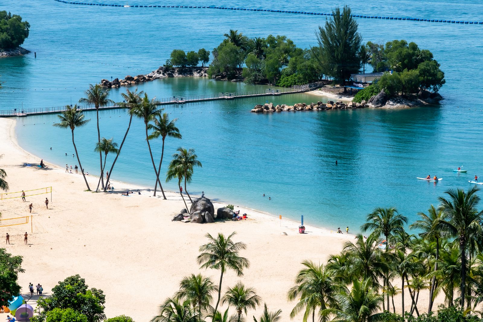 Sentosa Island beach with palm trees and turquoise water